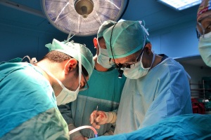Dr. Levent Elbeyli (in loupes) in the operating room